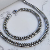 خرید ست گردنبند و دستبند مردانه استیل نقره ای رنگ ثابت