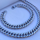 خرید ست گردنبند و دستبند مردانه نقره ای کارتیر رنگ ثابت