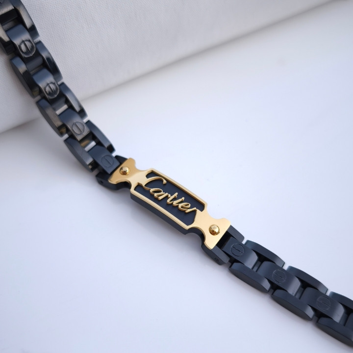 خرید دستبند مردانه مشکی طلایی استیل رنگ ثابت