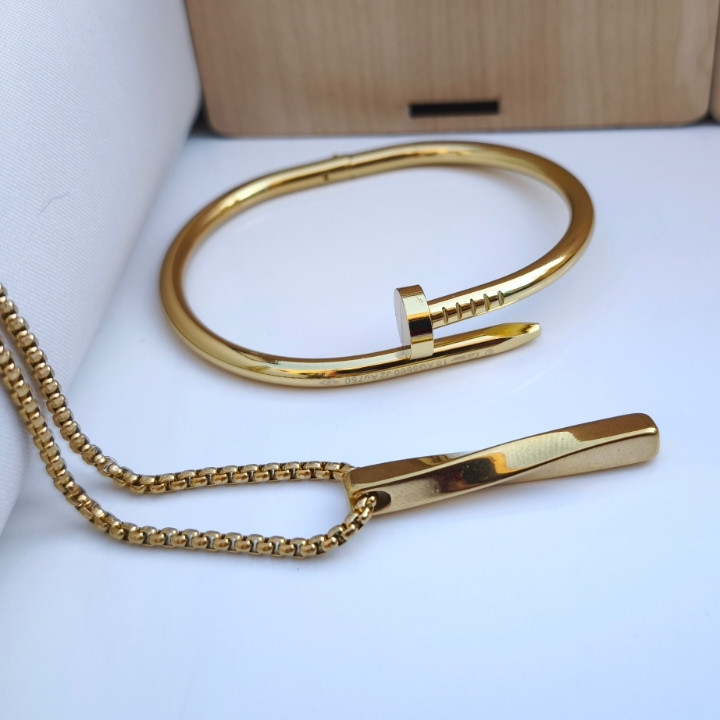 خرید ست گردنبند دستبند میخی مردانه طلایی استیل رنگ ثابت قیمت مناسب